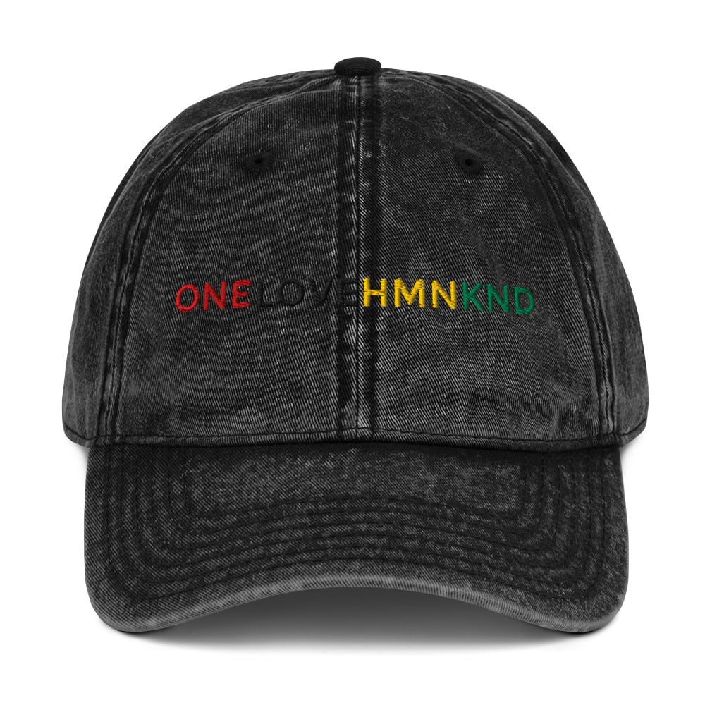 ONELOVEHMNKND black distressed baseball cap with embroidered rainbow text.