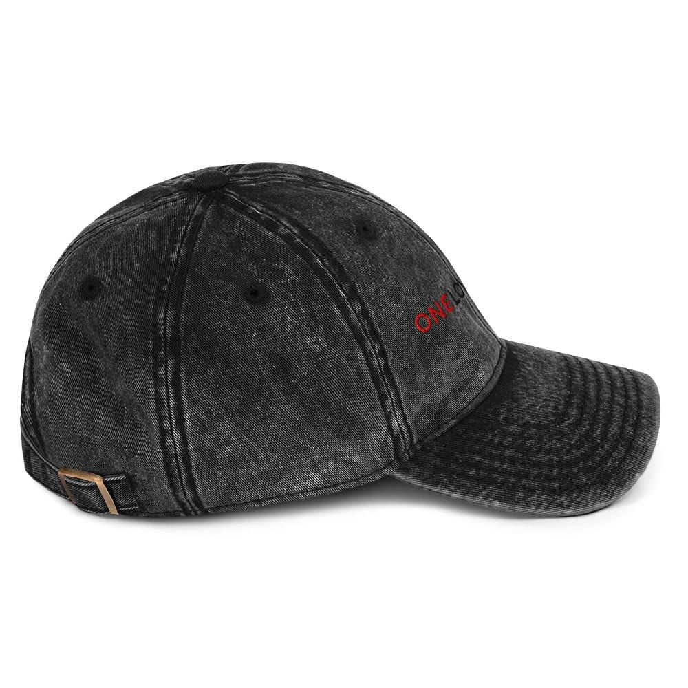 Vintage black distressed baseball cap with "ONE" embroidery in red, adjustable strap, casual streetwear style.