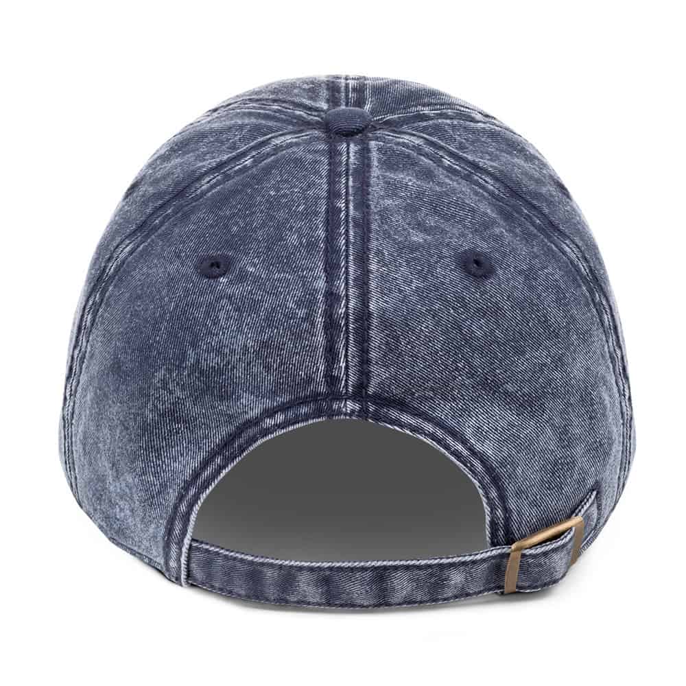 Distressed denim baseball cap with adjustable strap for casual streetwear style. Perfect accessory for everyday fashion.