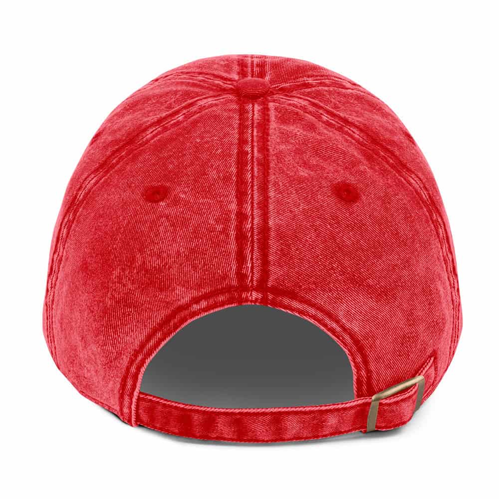 Red denim trucker hat with adjustable strap and button detail for casual streetwear style.